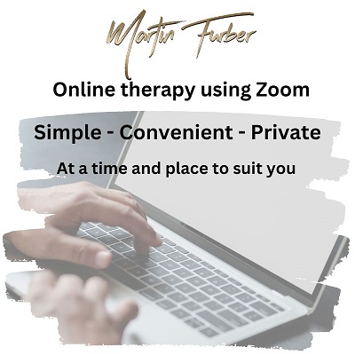 Person using a laptop to access online hypnotherapy with Martin Furber 
